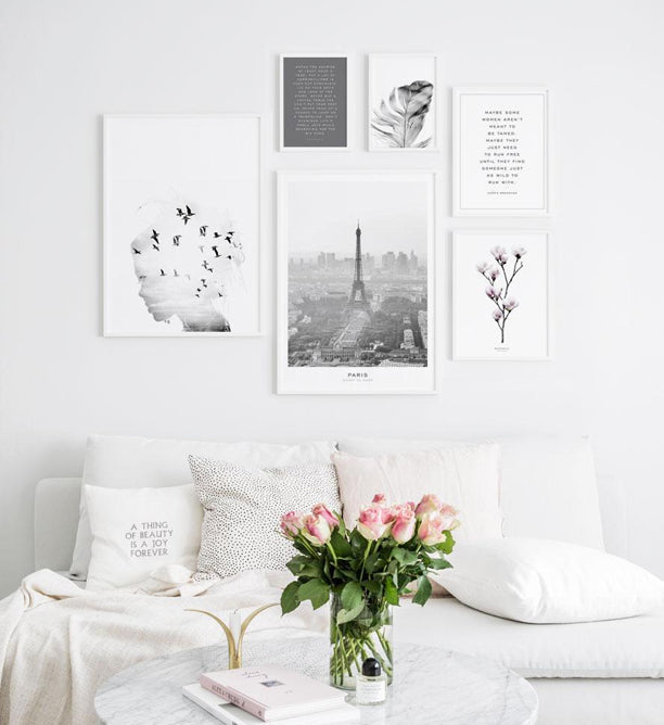Gallery wall with fashion posters in white frames